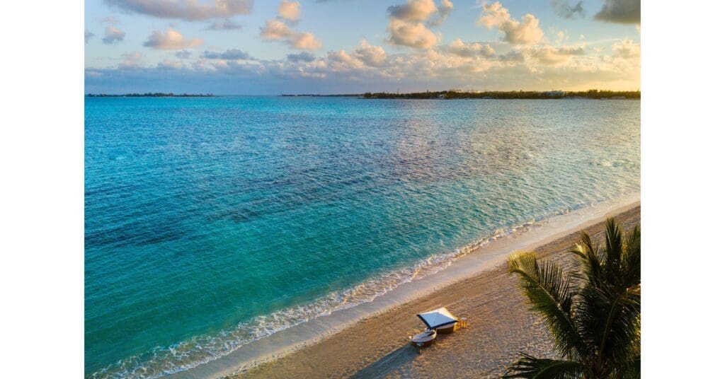 Private beach dinner for two at sunset at Rosewood Baha Mar, Bahamas. Best Rosewood honeymoon resorts.
